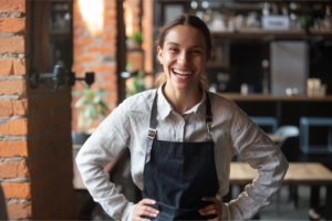 woman in apron smiling 